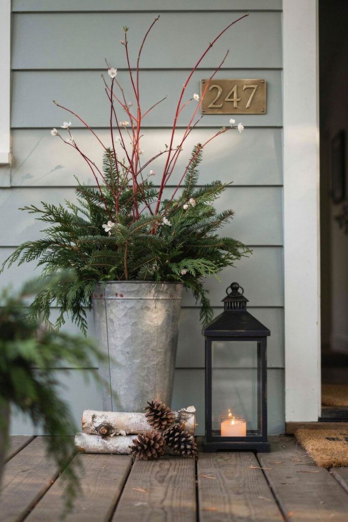 fill porch planters and lanterns that glow at dusk